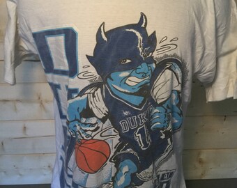 Vintage 1990's Duke Blue Devils Print all Over Basketball T-Shirt Jersey Made in USA