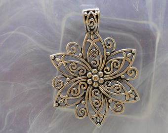 large silver metal flower pendant
