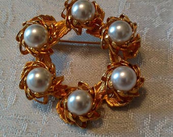 Gold tone pearl brooch