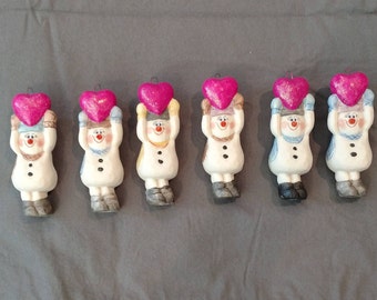 Snowman with heart ornament