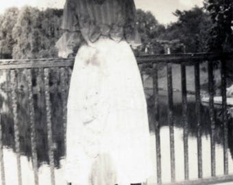 vintage photo 1917 big blouse Bow Woman from Back Looks Out over the Fence to Serene Water