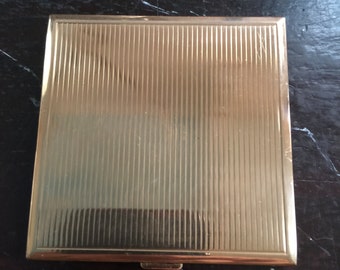 Lilly Dache compact,powder, made in Switzerland,circa 1955 in goldtone