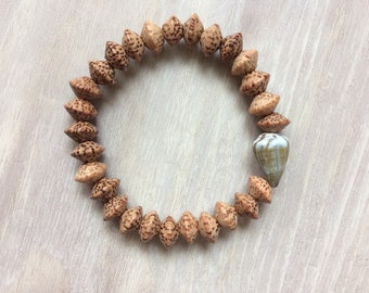 Seashell bracelet, stretchy bracelet with cone shell and palm wood beads, seashell jewelry, surfer bracelet