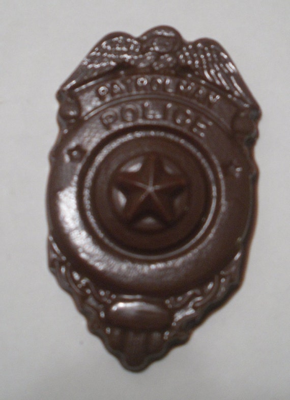 A dozen Patrolman Police Badges