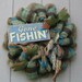 Fishing Theme Burlap Wall Door Wreath Decor. Gone Fishin sign with a string of fish.