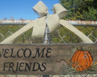 Welcome Friends outside hanging wood sign