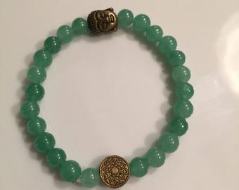 Green bracelet with bronze accents