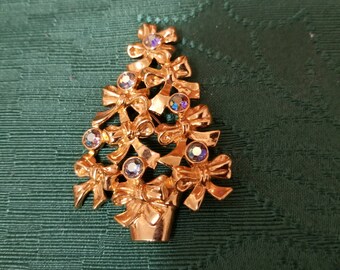Holiday festive Avon signed Christmas tree