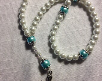 Glass prayer beads with blue accents