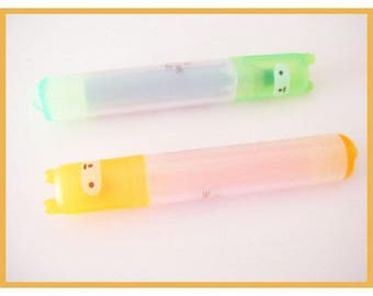 stationery - two highlighters fluorescent orange and green kawaii