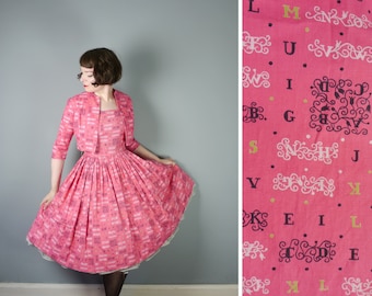 50s pink NOVELTY dress with matching bolero jacket by REMBRANDT - typeface LETTER alphabet print - full skirt Mid Century cotton dress - s-m