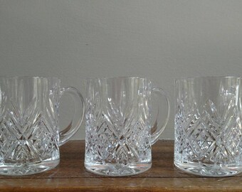 Set of three decorative glass mugs
