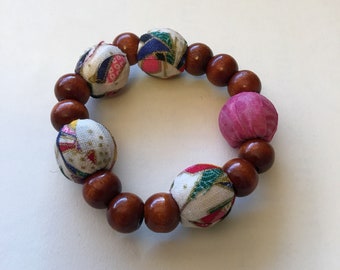 Pink and white fabric stretchy cord bracelet