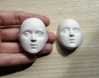 Doll face. Handmade doll. Art sculpture. Workpiece for doll