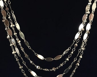 Silver four strand necklace