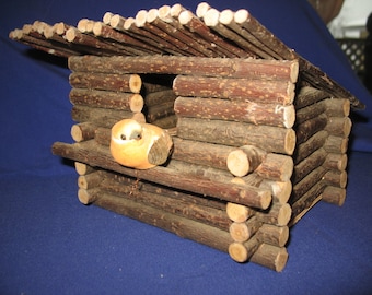Rustic wood birdhouse. Decorative cabin, cottage, craft.