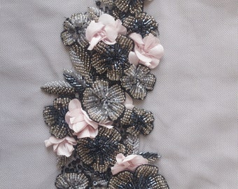 Hand-made motif with beaded appliqué flowers