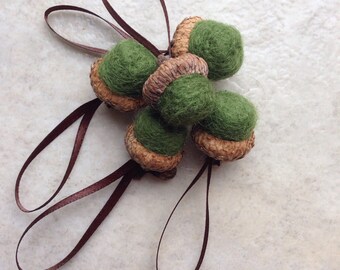 5 wool needle felted acorn ornaments in moss green with brown ribbon hangers