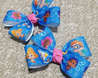 Set of 2 bubble guppies hair bow on a non slip alligator clip