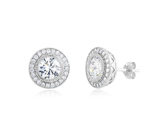 Rhodium plated Sterling Silver 6.5mm round CZ post earrings.
