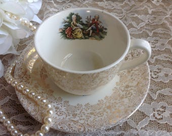 Royal China Co Colonial Gold Cup and Saucer Shabby Chic Wonderful gold filigree and Romantic Couple in Center 22-K-Gold