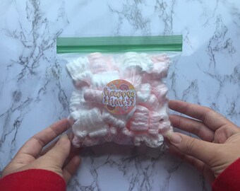 White and pink packaging peanuts.