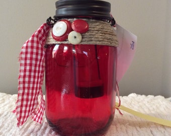 Red glass lantern jar-red &white gingham ribbon-brown metal lid-star cutout-hanging lantern-candle-jute-buttons-led light-vintage-primitive