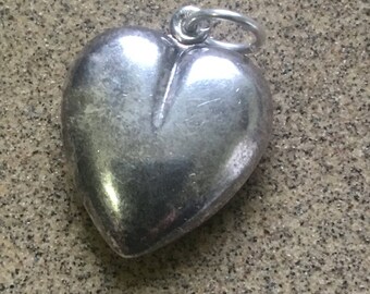 Large silver heart pendant (vintage ) in fair condition for age worn in places from use ! On a jumpring !