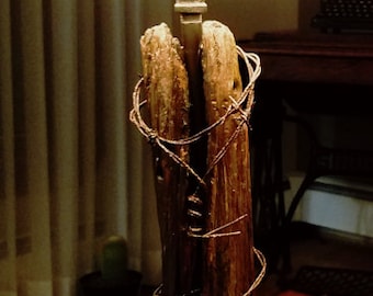 1800s Cedar fence post with barbed wire.