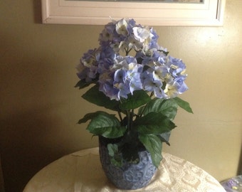 Faux Silk light blue hydrangea arrangement with dark green leaves in Blue Floral Ceramic pot.