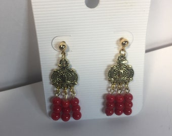 Gold colored medallion earrings