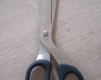 Large scissors sewing fabric