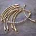 10 Links, gold-plated brass, 38x8mm twisted curved. - JD212