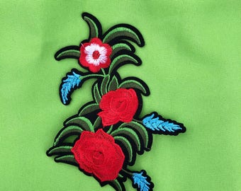 Embroider multicolor flower iron on.