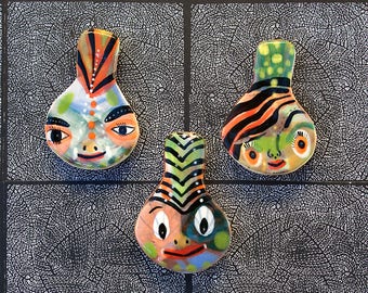 Three Face Shaped Refrigerator Magnets by Jenny Mendes