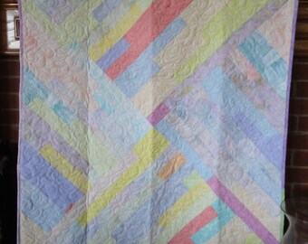 Custom baby quilt of pastel batiks for boy or girl
