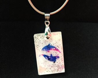 Enamored killer whales pendant