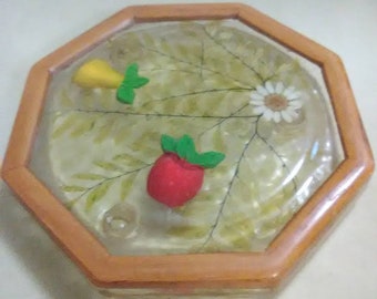 Vintage clear and wood trivet. Pear, apple and daisy design. Plastic and wood. Red, yellow and white.