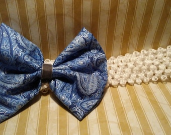 Blue fabric paisley bow on band.