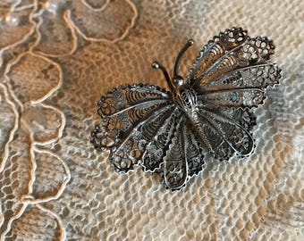 Vintage filigree butterfly brooch