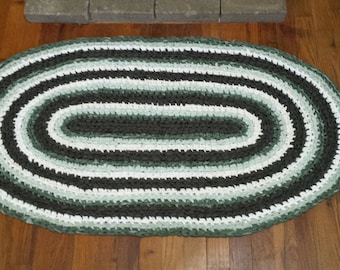 Green and cream crocheted rag rug