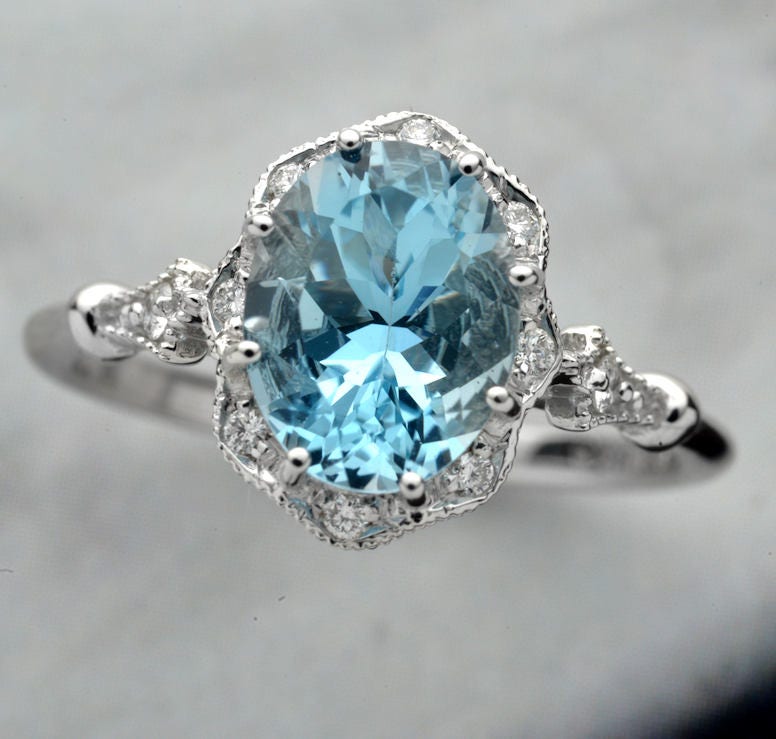 Engagement ring Natural blue Aqua marine 9x7 with a Flower