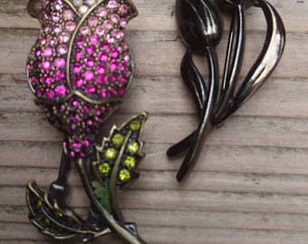 Two vintage flower brooches