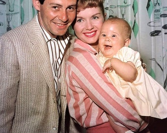 Eddie Fisher and Debbie Reynolds with daughter Carrie in 1957.