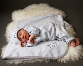 hand-embroidered welcome home outfit for baby.