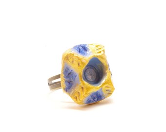 Carved blue and gold square ring
