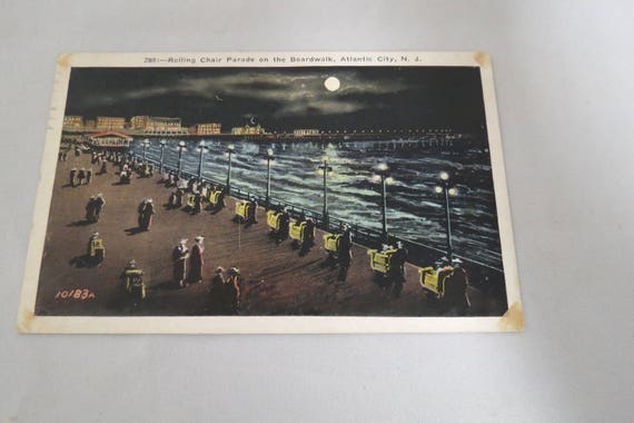 vintage atlantic city boardwalk rolling chair parade night