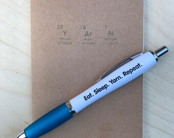 Periodic table YArN notebook and pen.