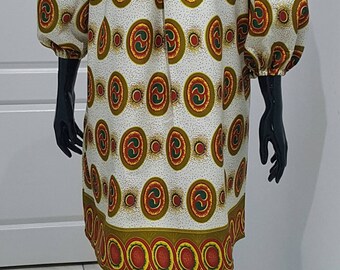 African print off shoulder dress.