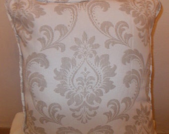 Jacquard cotton weave cushion covers in Cream, with a piped edging.